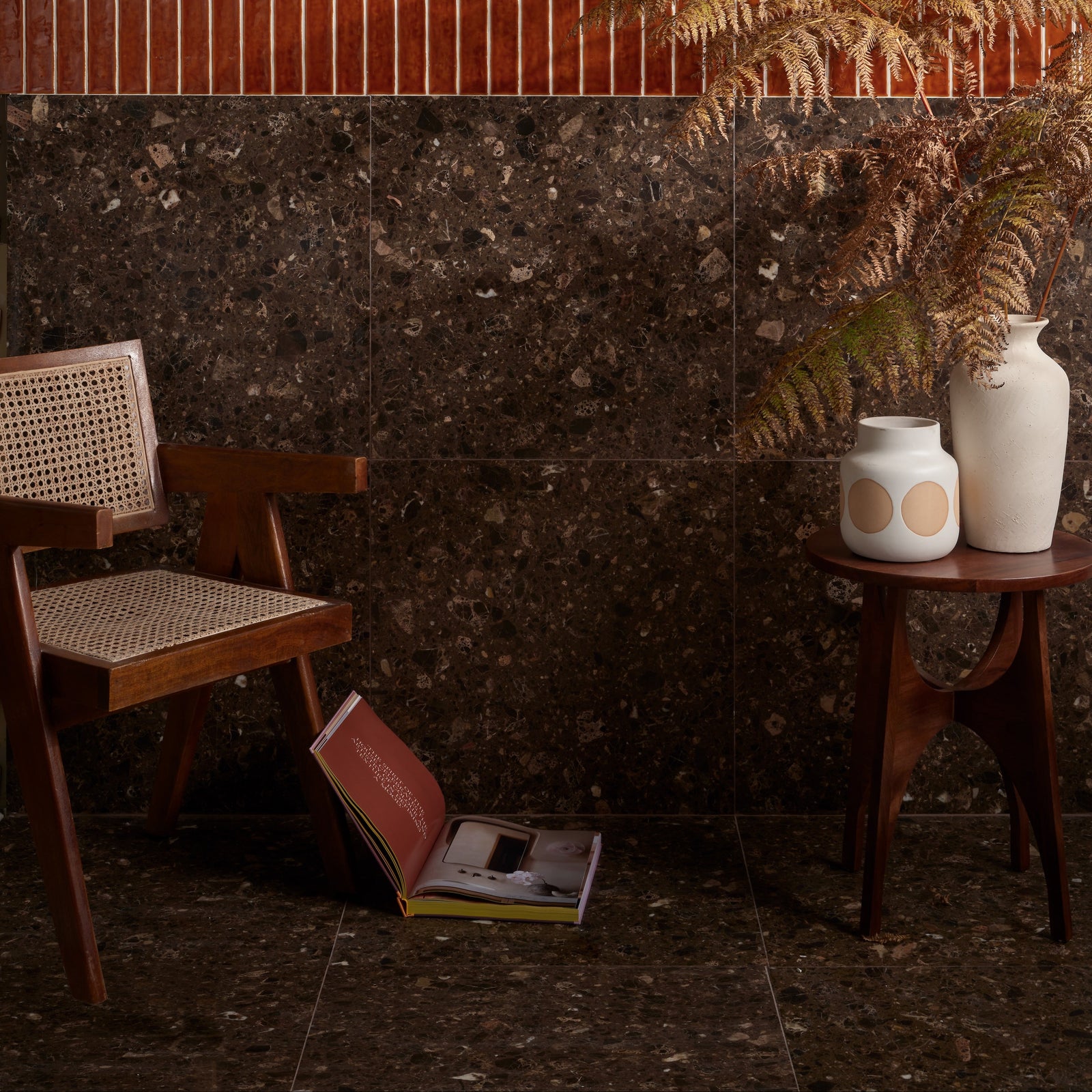 Dark brown rialto terrazzo ca’doro honed wall tiles with speckled stone texture and subtle metallic flecks