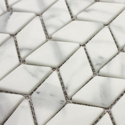 Ritz Carrara Diamond Chevron Mosaic white marble tiles with subtle grey veining in a diamond chevron pattern