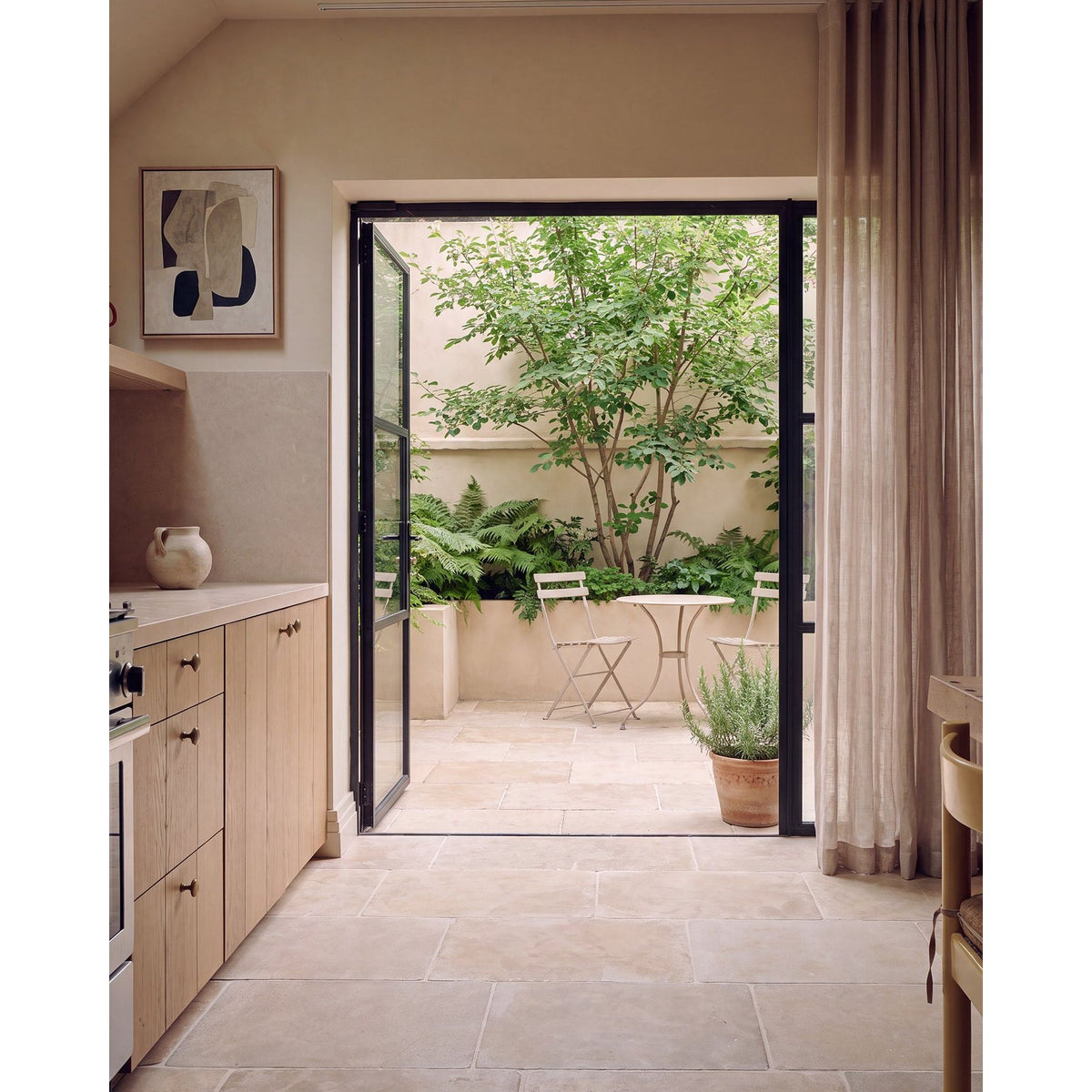 Romaine Limestone Tumbled Finish flagstone floor in a room setting