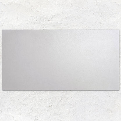 A sleek rectangular mirror with a smooth matte silver finish from rush white 60x30cm collection