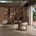 Modern interior with wooden bookshelf, chair, and table in a well-lit room.