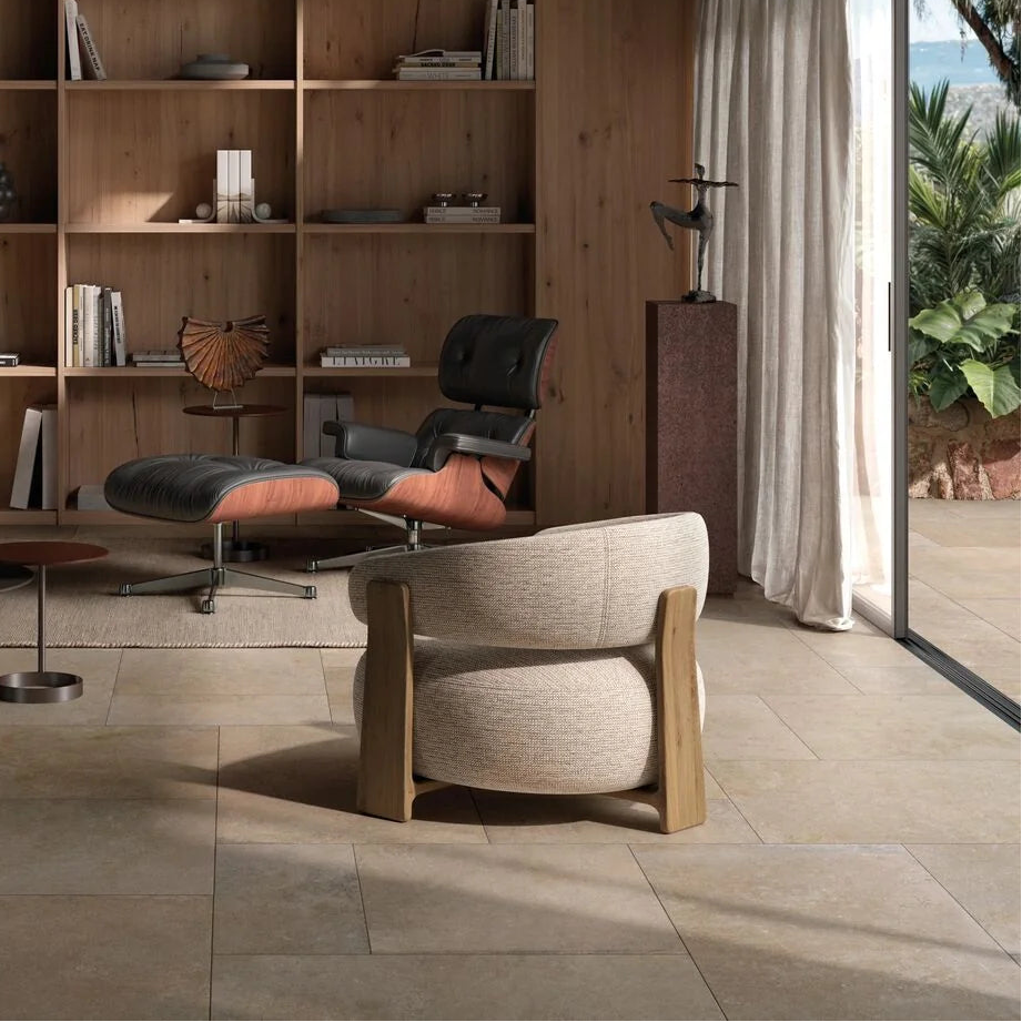 Modern interior with wooden bookshelf, chair, and table in a well-lit room.