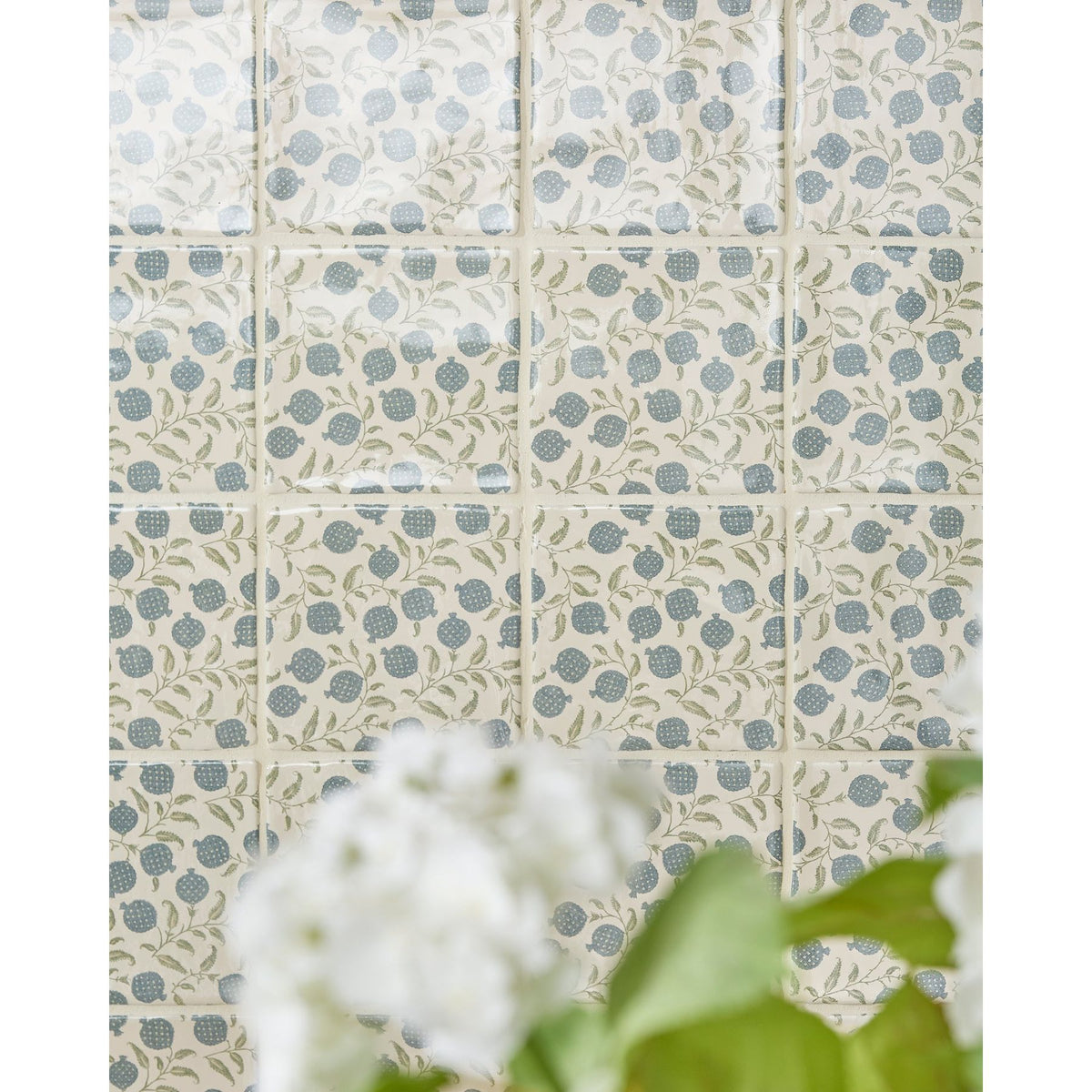 STUDIO Sanderson Anaar Pottery Blue tiles laid up as a panel of repeating pomegranates