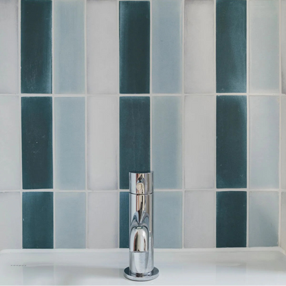 Chrome finished single-handle bathroom faucet with sleek modern design featured in south cliff teal brick tile setting