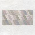 A rectangular South Beach Collins ceramic tile 60x30cm with modern pastel diagonal stripes and subtle marble veining