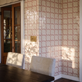 STUDIO Sanderson Oxbow Check Madder tiles on a dining room wall