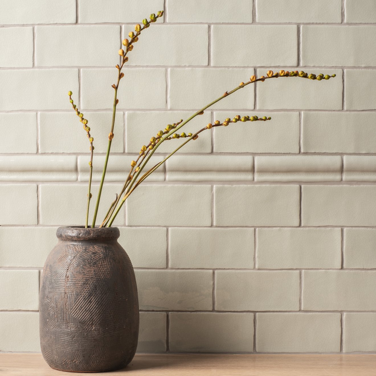 Dark gray textured ceramic vase with subtle geometric patterns torus moulding tern design
