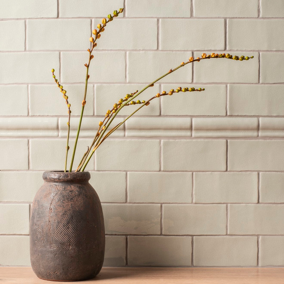 Dark gray textured ceramic vase with subtle geometric patterns torus moulding tern design