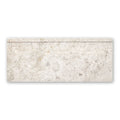 Westhampton skirting honed rectangular off-white marble tile with subtle gray veining and raised decorative border
