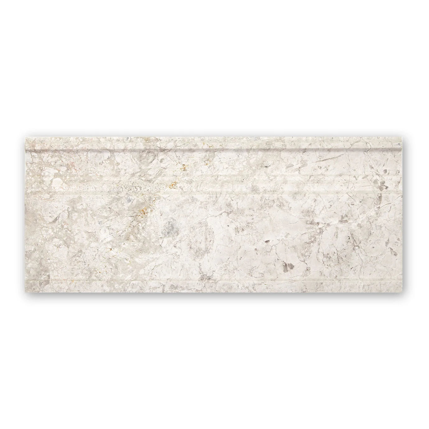 Westhampton skirting honed rectangular off-white marble tile with subtle gray veining and raised decorative border