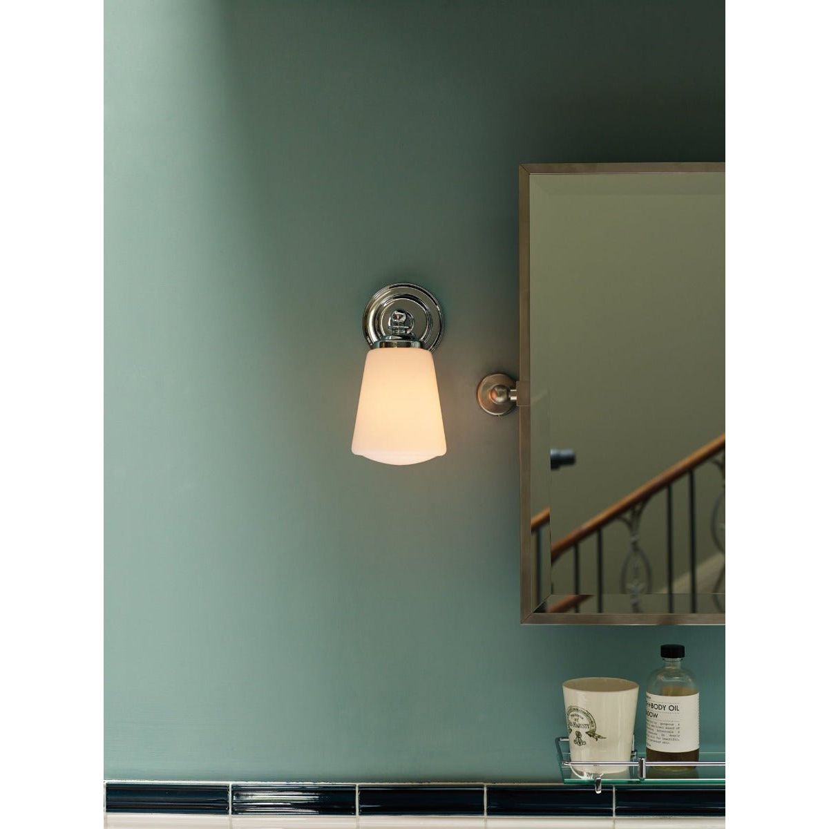 A dip in the lake sleek chrome wall sconce with frosted glass shade for modern indoor lighting