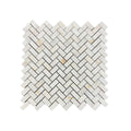 Honed Calacatta Sugar marble herringbone mosaic sheet in bright white with gold and taupe veining