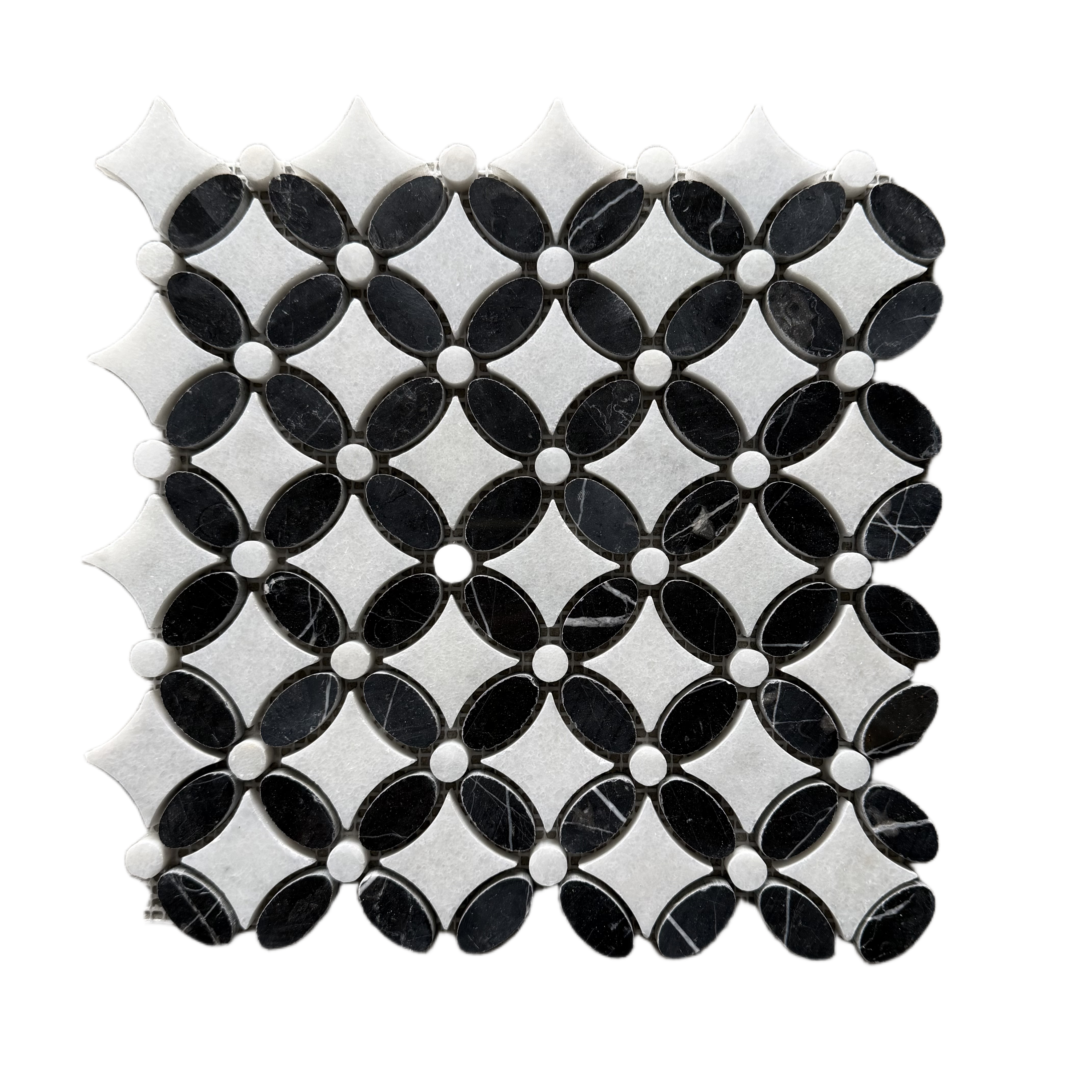 Overhead view of the black and white marble flower pattern repeating across several sheets
