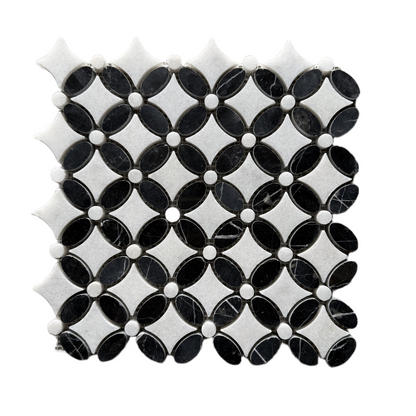 Overhead view of the black and white marble flower pattern repeating across several sheets