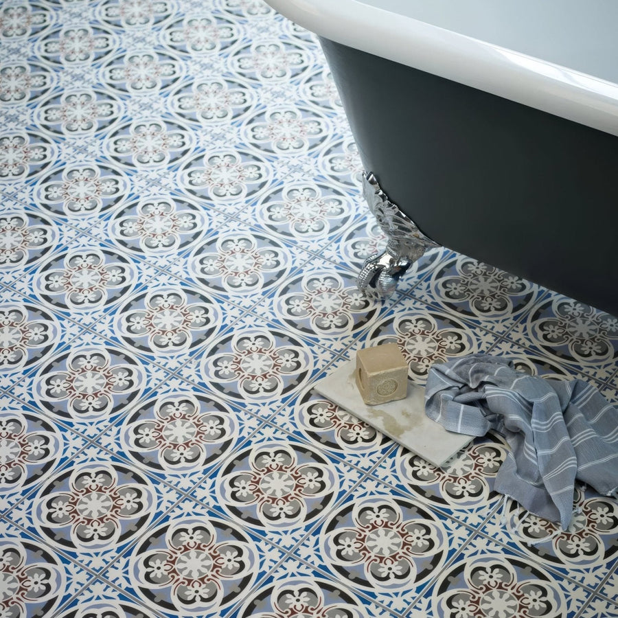 Vintage-style abbey fountains patterned tile featuring blue white and gray ornate floral bathroom floor design