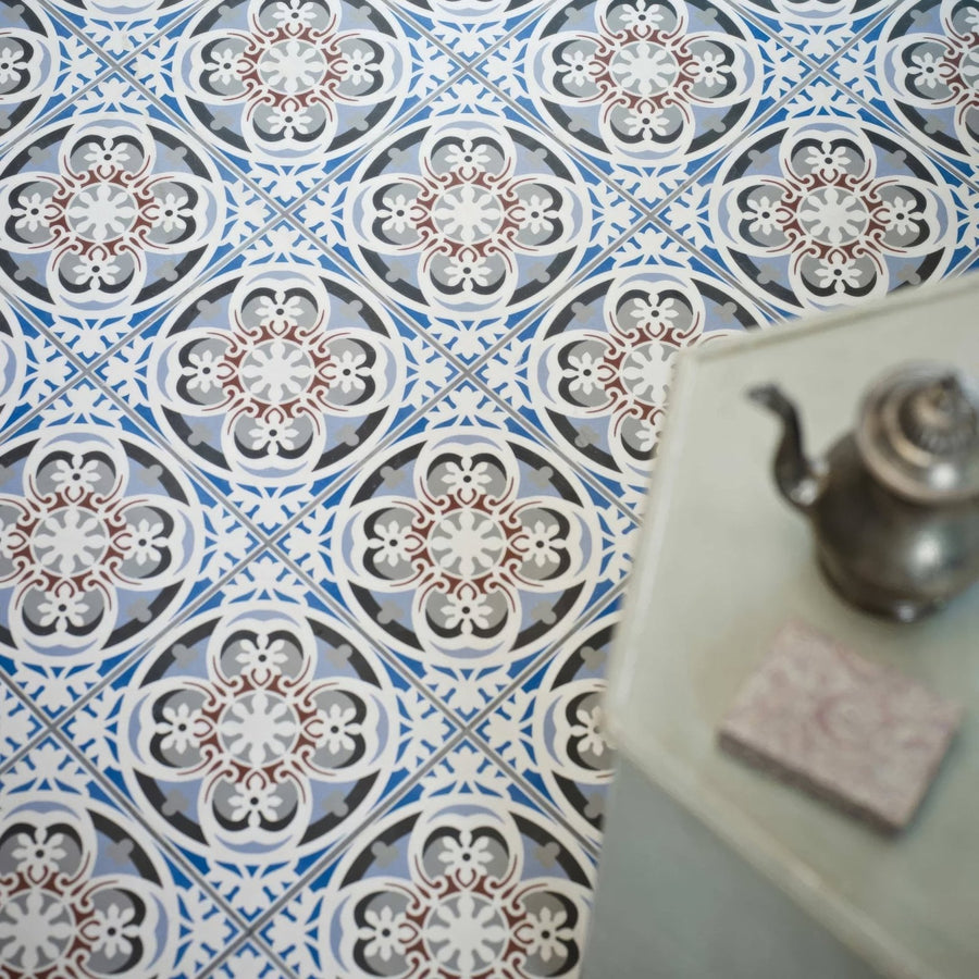 Abbey Fountains patterned ceramic floor tile with blue white and gray intricate floral designs