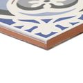 Abbey fountains patterned tile featuring blue and gray ornate ceramic design with terracotta edge