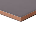 Gray abbey iron ceramic tile with smooth glossy surface showing brown backing on the back side