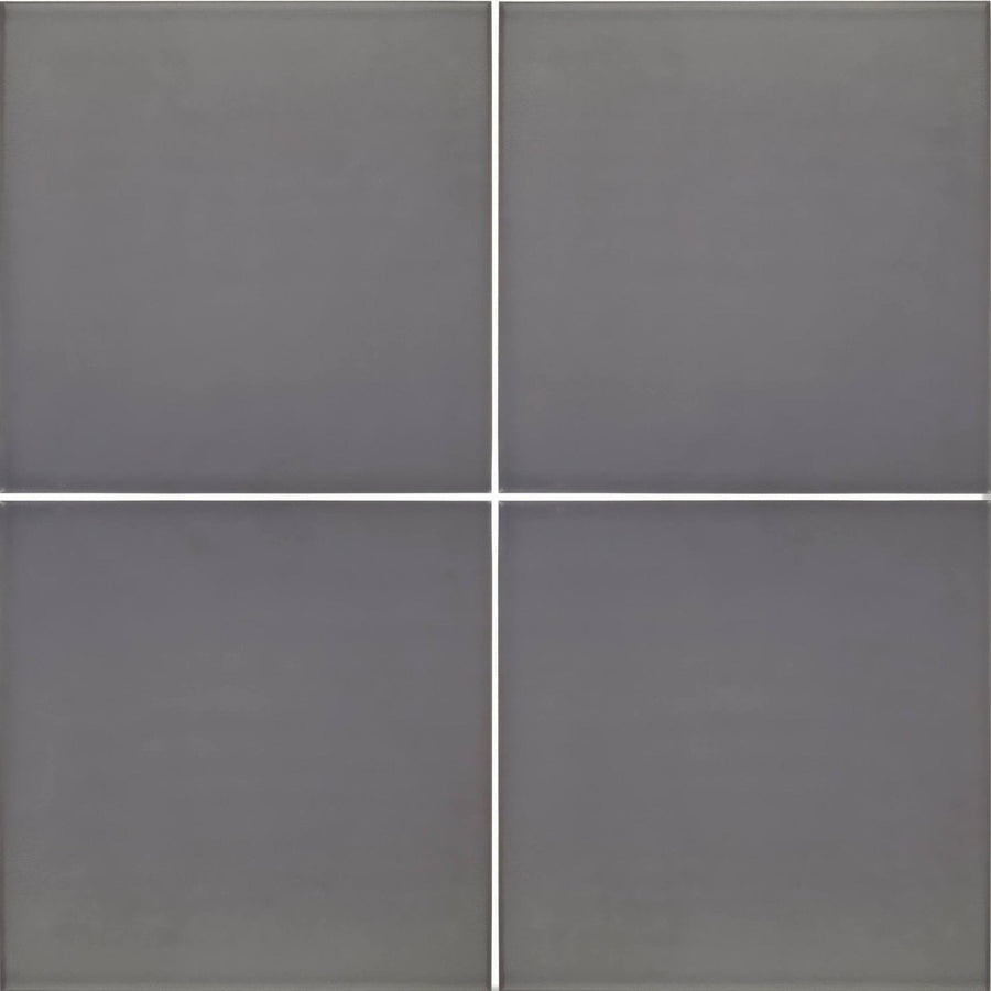 Four matte gray abbey iron tiles arranged in a grid showcasing their iron material and square shape