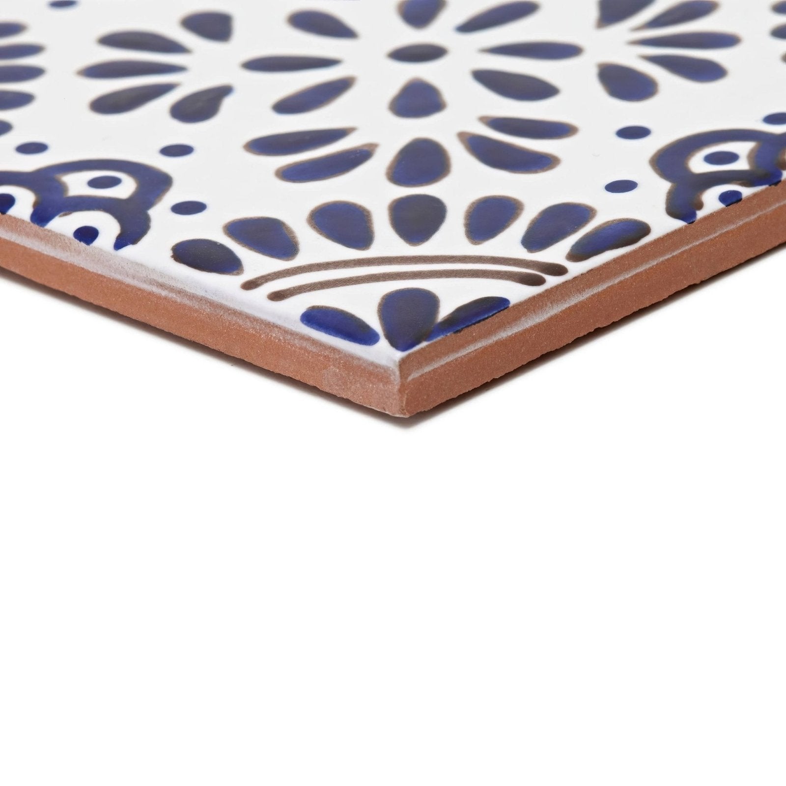 White ceramic tile acapulco lozano 10x10cm with intricate blue and brown floral patterns for decorative use
