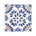 A square acapulco lozano ceramic tile 10x10cm with a white base and intricate blue and brown hand-painted floral patterns