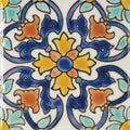 Acapulco Luna 10x10cm hand-painted ceramic tile with a symmetrical floral design in blue yellow and orange on white background