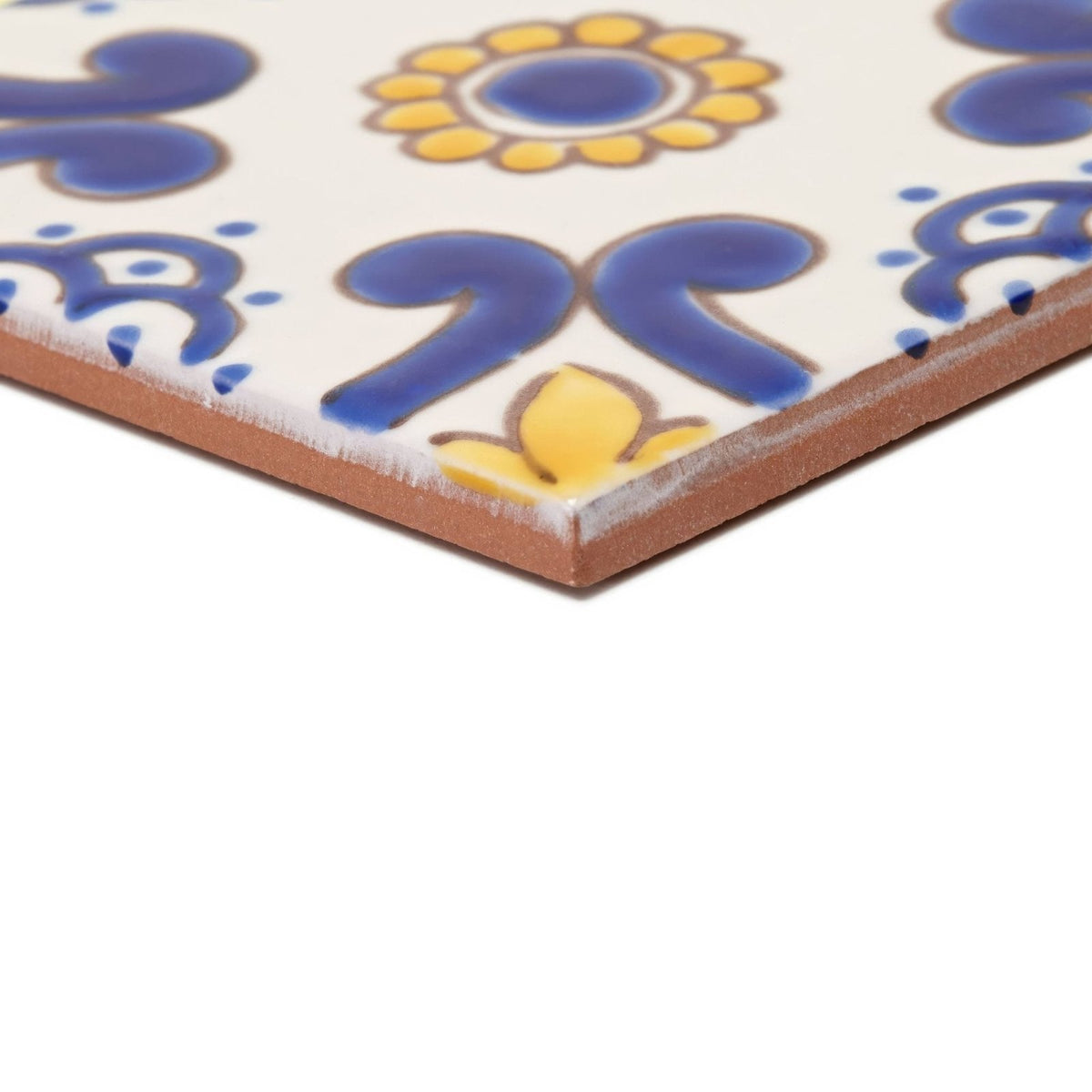 Acapulco ortiz 10x10cm square ceramic tile with white surface blue and yellow floral patterns and unglazed terracotta edge