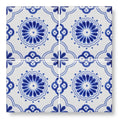 White ceramic 10x10cm acapulco salazar tile with intricate blue floral and geometric patterns