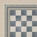A classic black and white checkered tile floor with an ornate geometric border in adventuras linen field porcelain