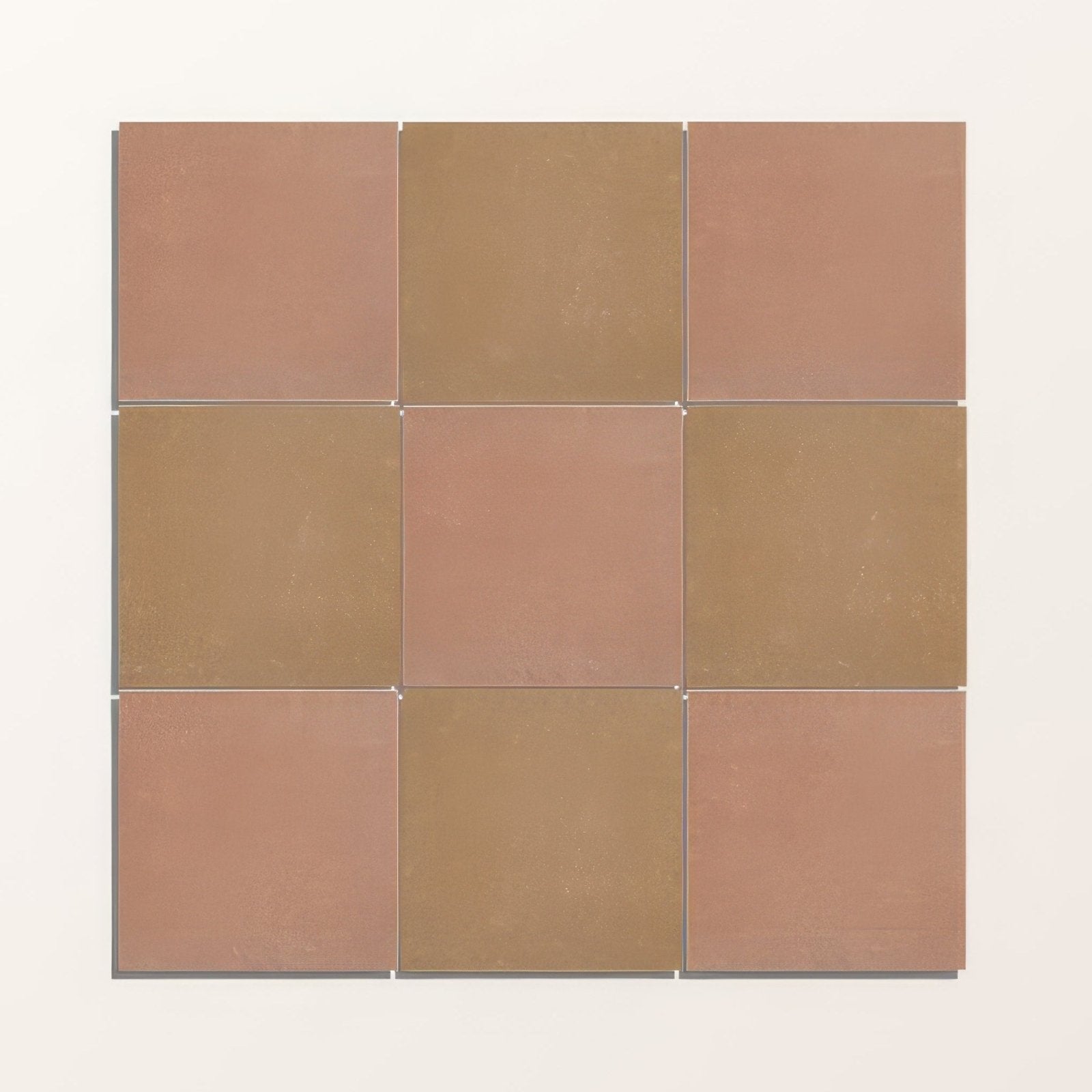 A square arrangement of nine matte finished adventuras ochre field porcelain tiles in terracotta and muted brown tones