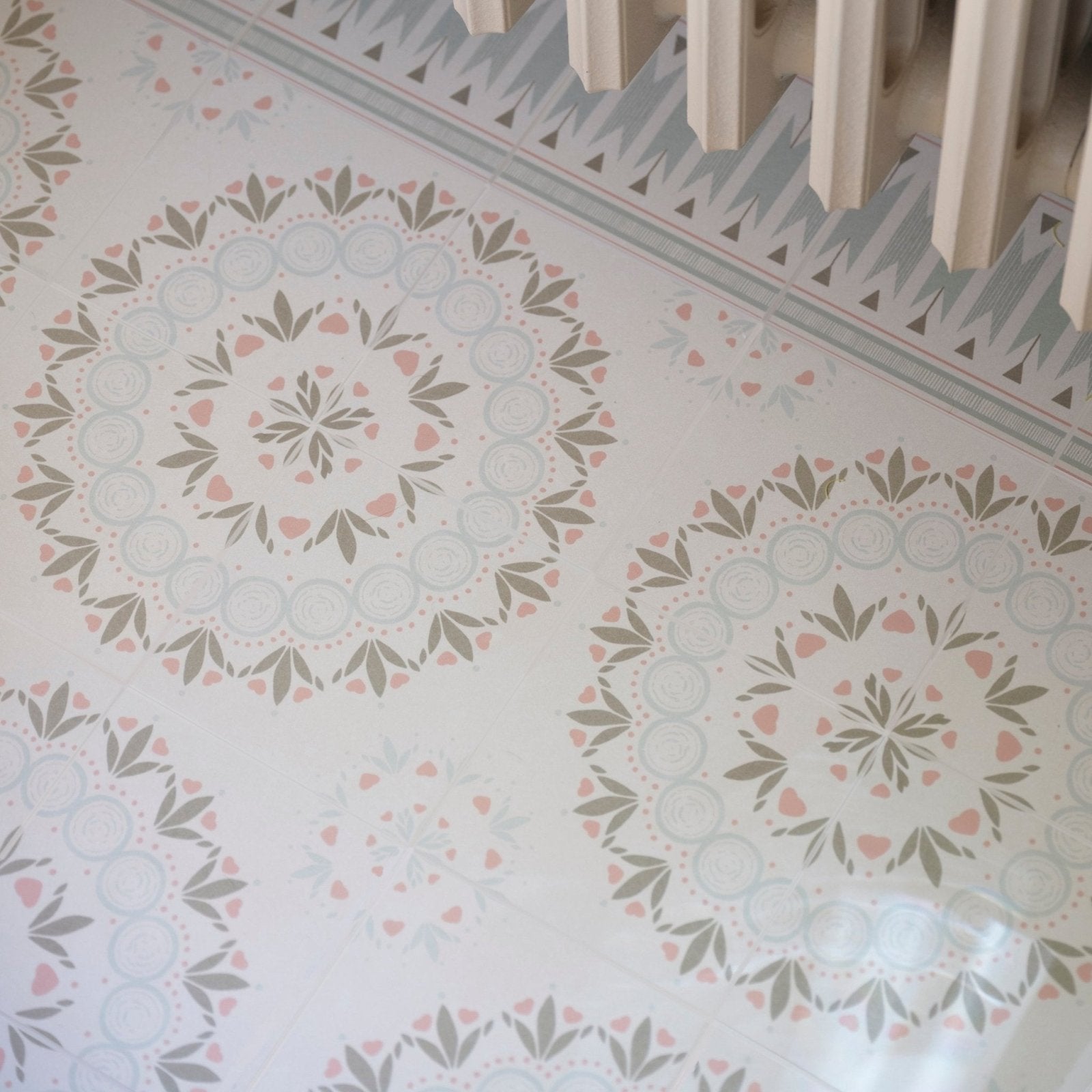 Adventuras palma olive porcelain floor tiles with white base and intricate pink and muted green mandala patterns