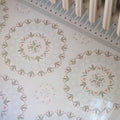 Adventuras palma olive porcelain floor tiles with white base and intricate pink and muted green mandala patterns