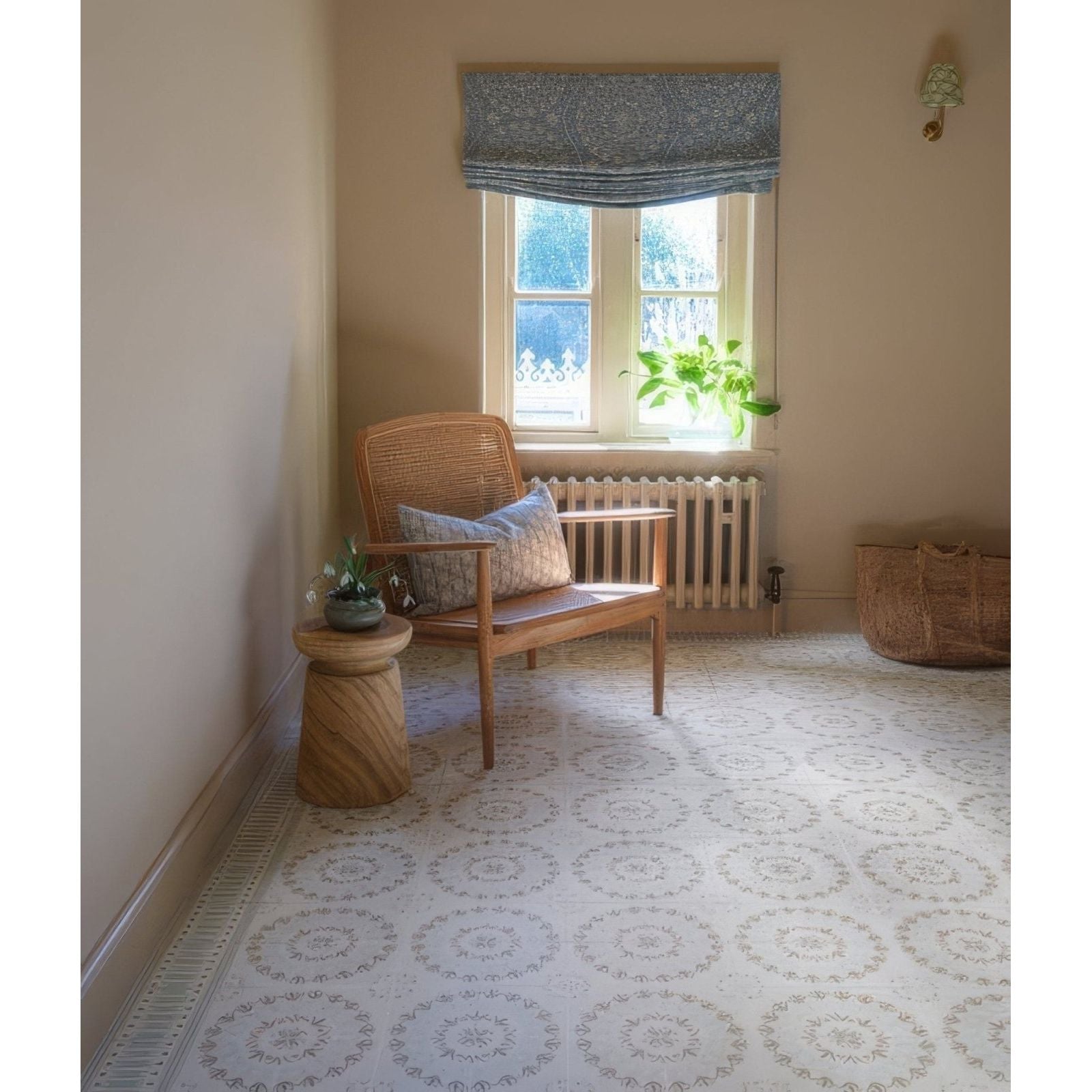 Woven rattan chair with wooden frame and light blue patterned cushion from adventuras palma olive porcelain collection