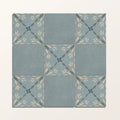Adventuras porto blue porcelain square ceramic tiles with muted blue-gray base and cream dark green leaf patterns