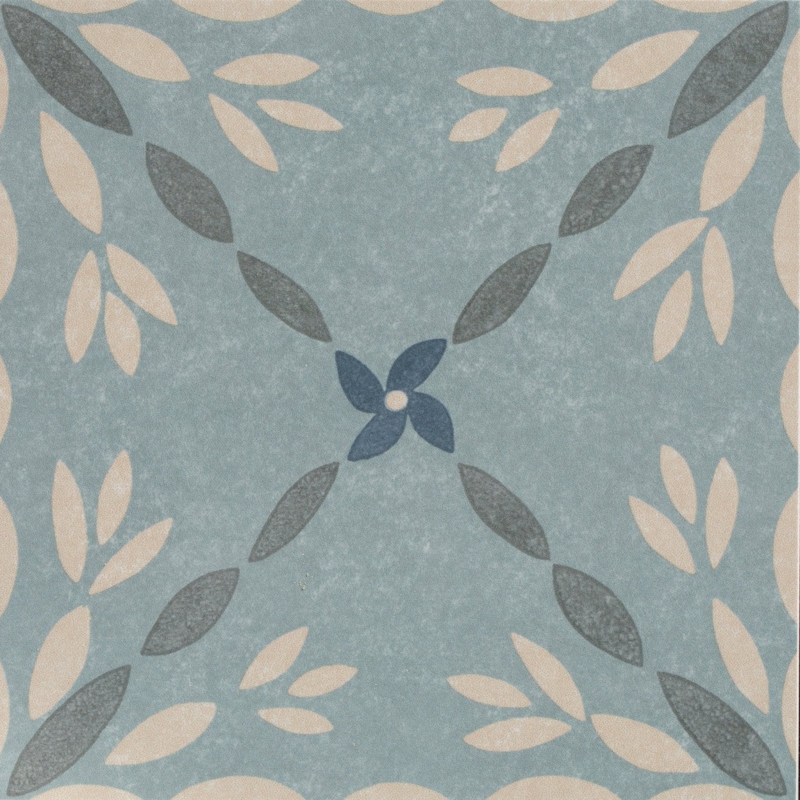 A square porcelain tile adventuras porto blue with a soft blue background and cream dark gray leaf pattern