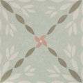 Adventuras Porto Olive porcelain tile with a mint green base featuring a central pink flower and taupe white leaves pattern