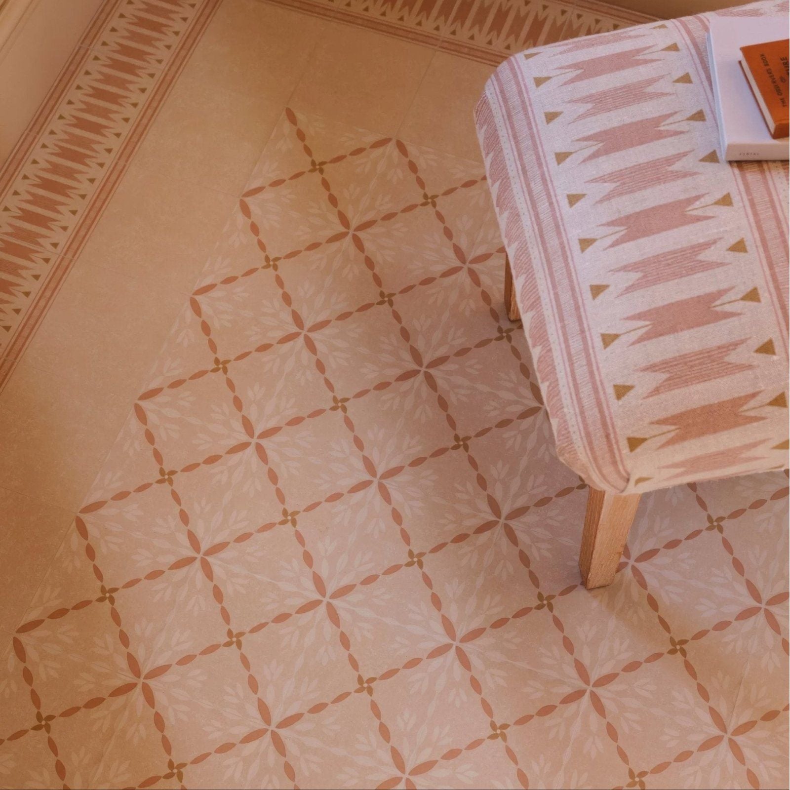 Beige and pink geometric patterned terracotta porcelain floor tiles with a subtle leaf motif from adventuras porto