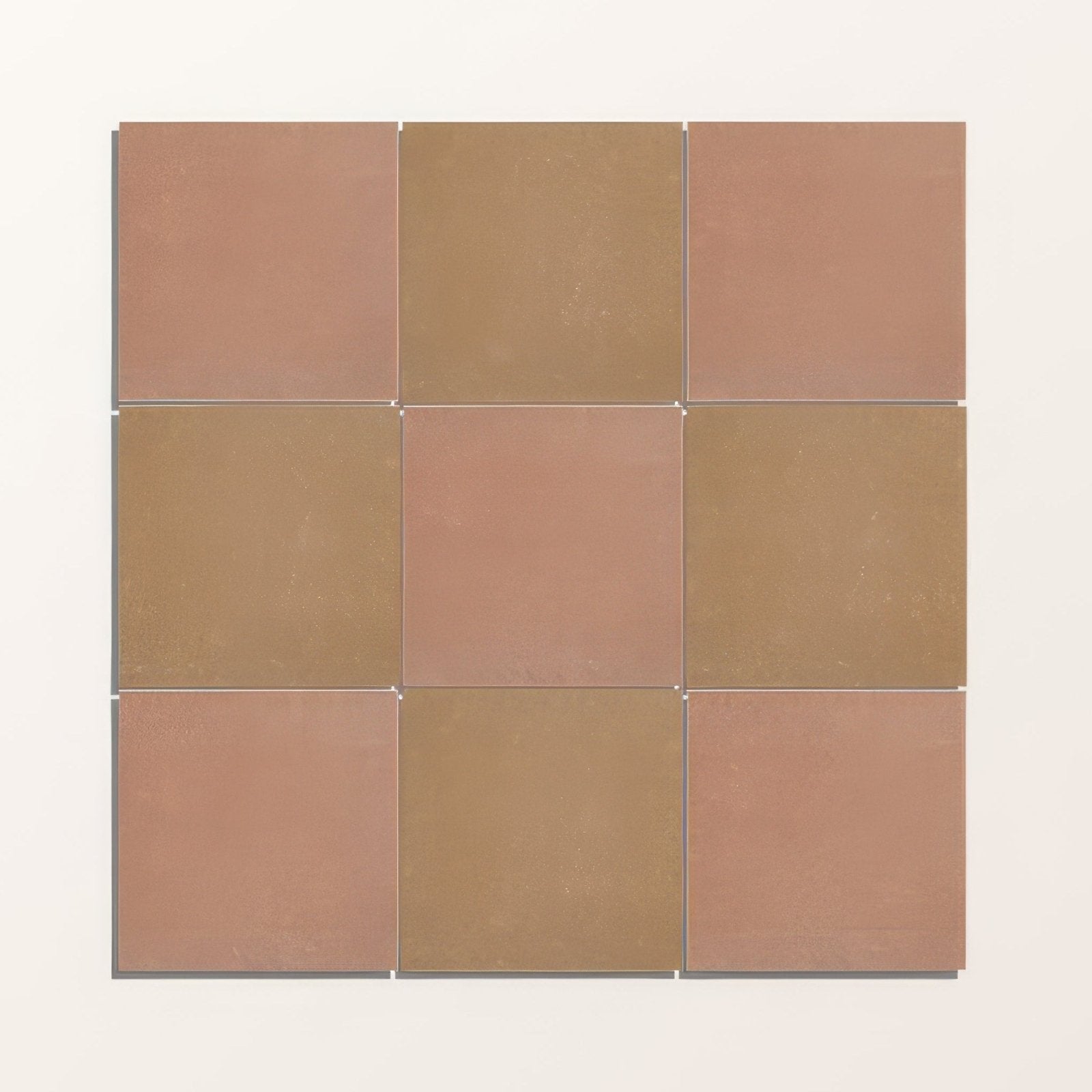 A square arrangement of nine matte terracotta and muted gold ceramic porcelain tiles from adventuras terracotta field