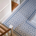 Blue and white geometric patterned floor tile with repeating diamond design made of porcelain called adventuras ziggy corner blue
