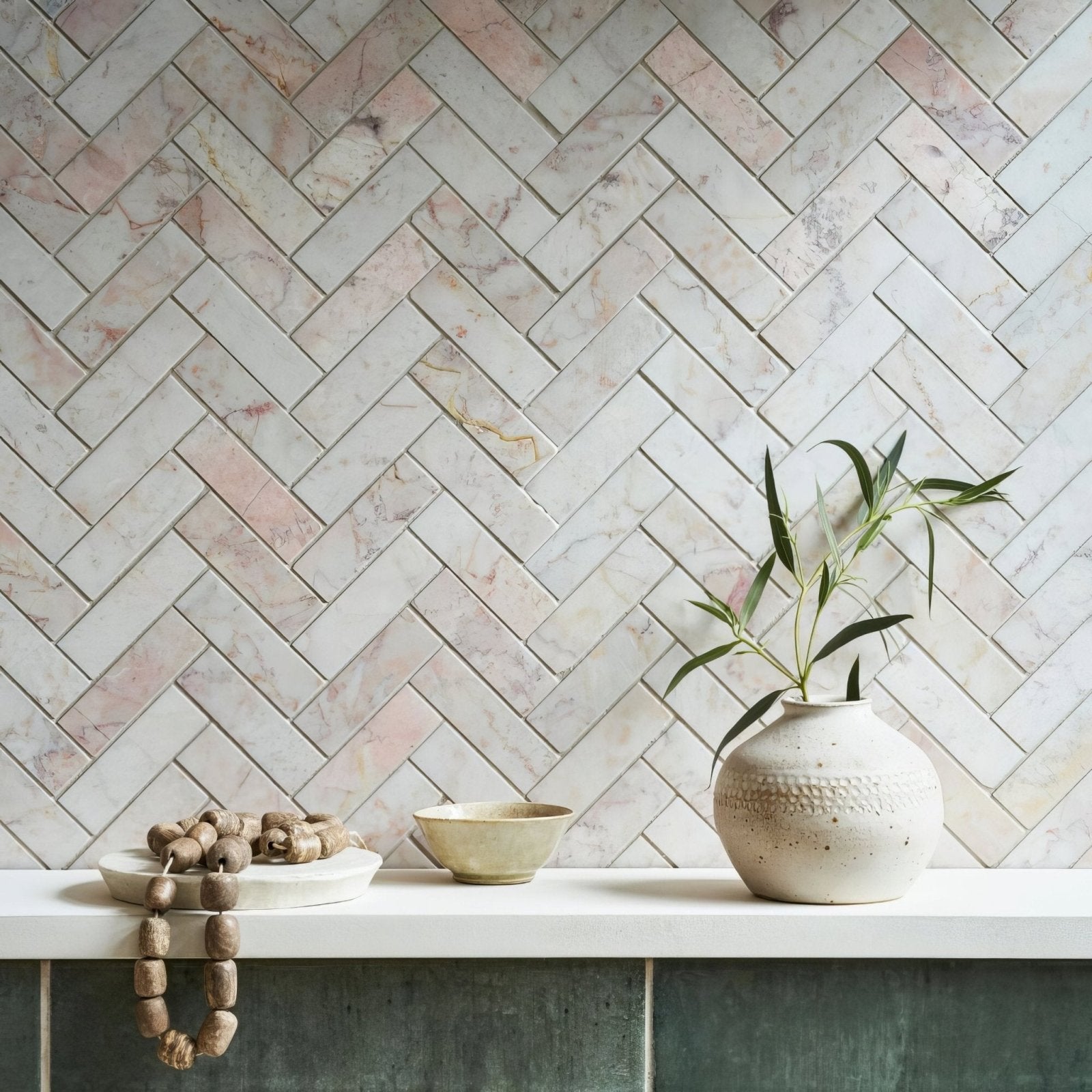 Aegean Pink Herringbone Marble Mosaic pink marble herringbone mosaic styled with an off-white ceramic vase