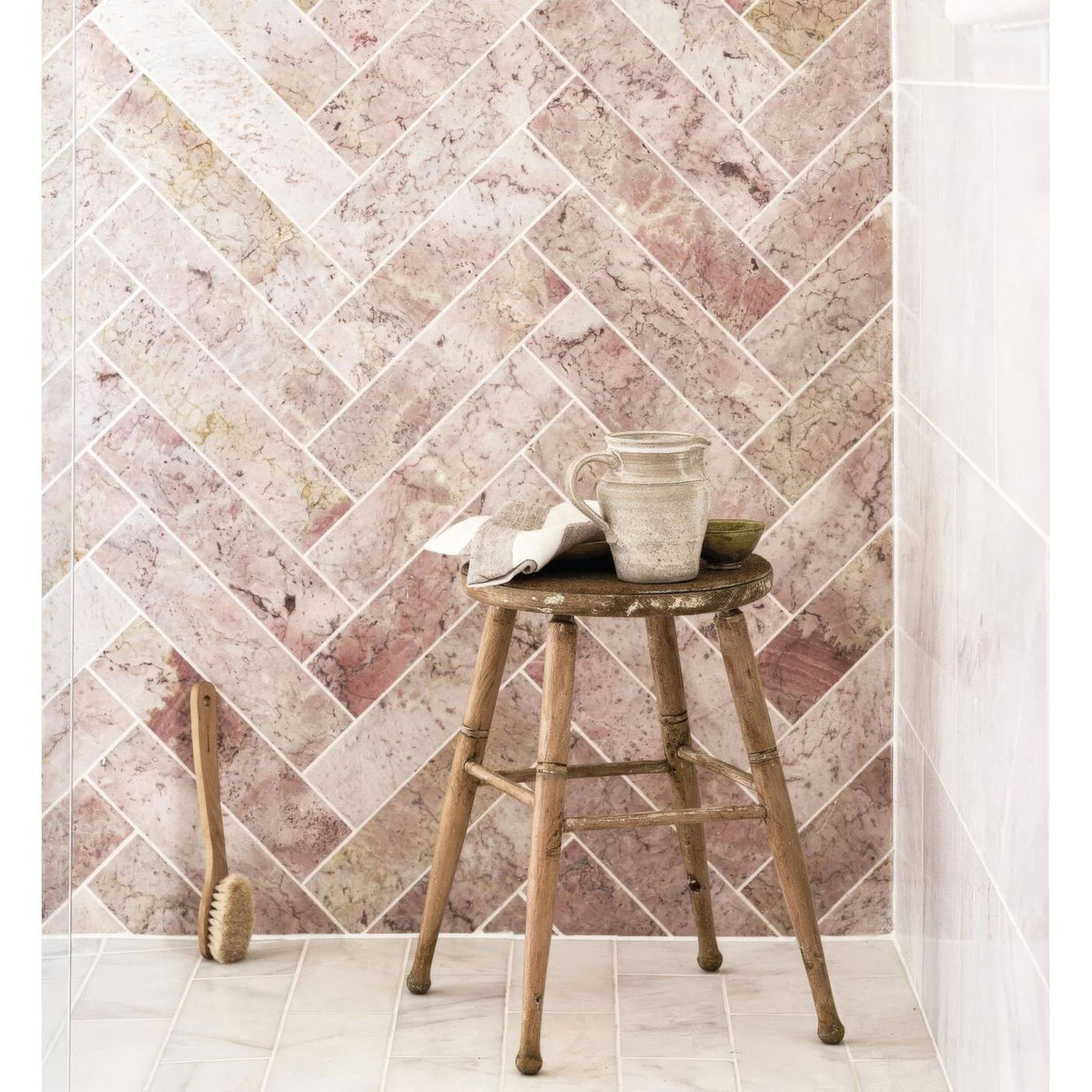 Aegean pink marble tile 7.5 x 30.5cm with rustic wooden stool featuring round seat and weathered texture
