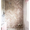 Herringbone-patterned aegean pink marble-effect bathroom tiles in pink and beige 7.5 x 30.5cm size