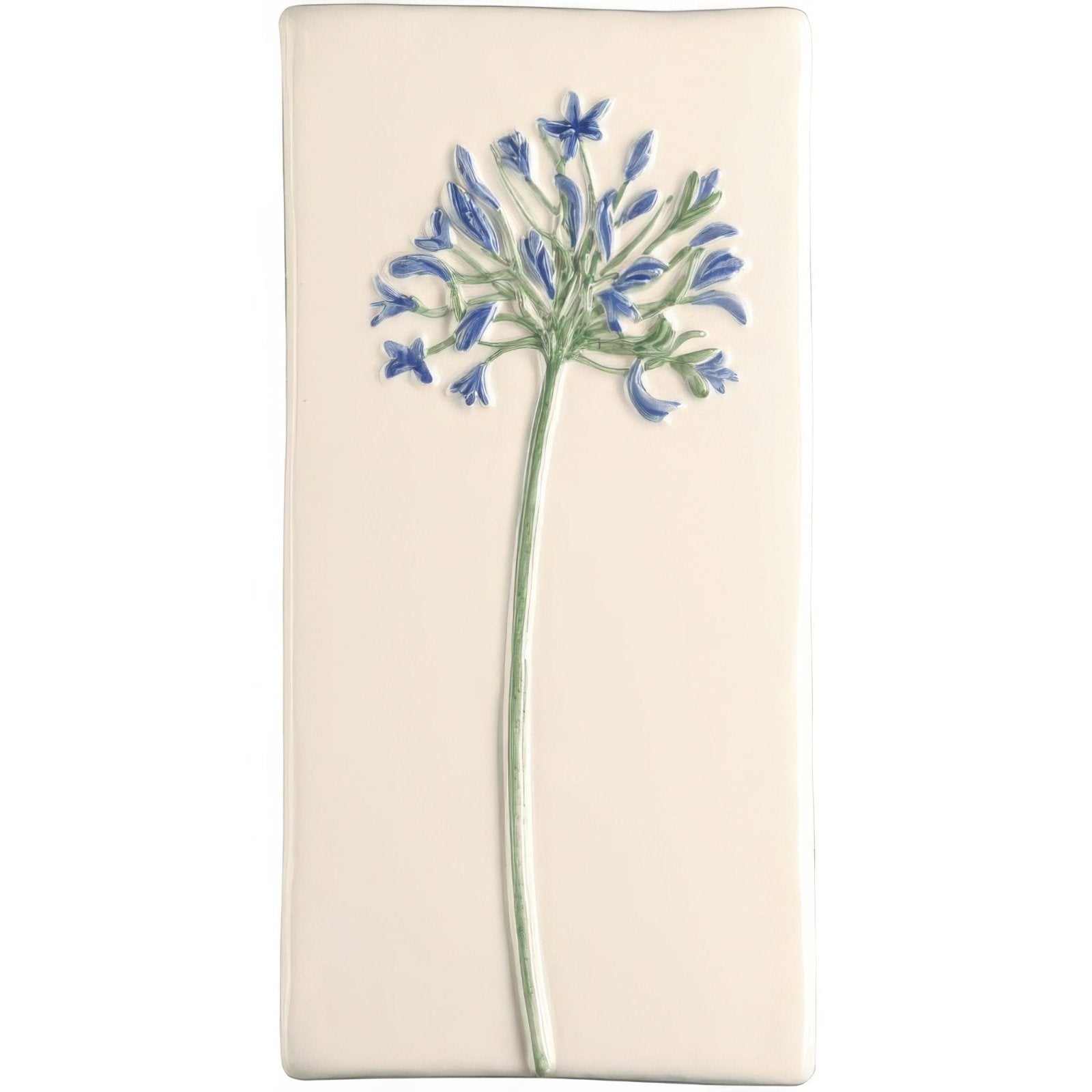 Cream-colored ceramic tile with raised hand-painted blue agapanthus flower and green stem called Agapanthus on off white