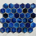 Hexagonal blue Akazu porcelain cobalt mosaic tile with glossy iridescent finish and metallic grout detailing