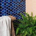 Akazu Porcelain Cobalt Mosaic deep blue hexagonal porcelain mosaic tiles styled with a green fern