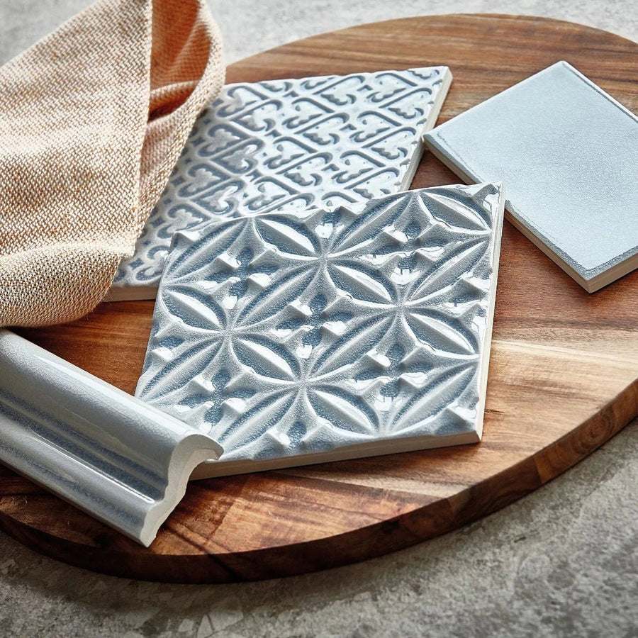 Gray ceramic alhambra blue glazed dado tile 5 x 15 cm with raised geometric and floral patterns and matte finish