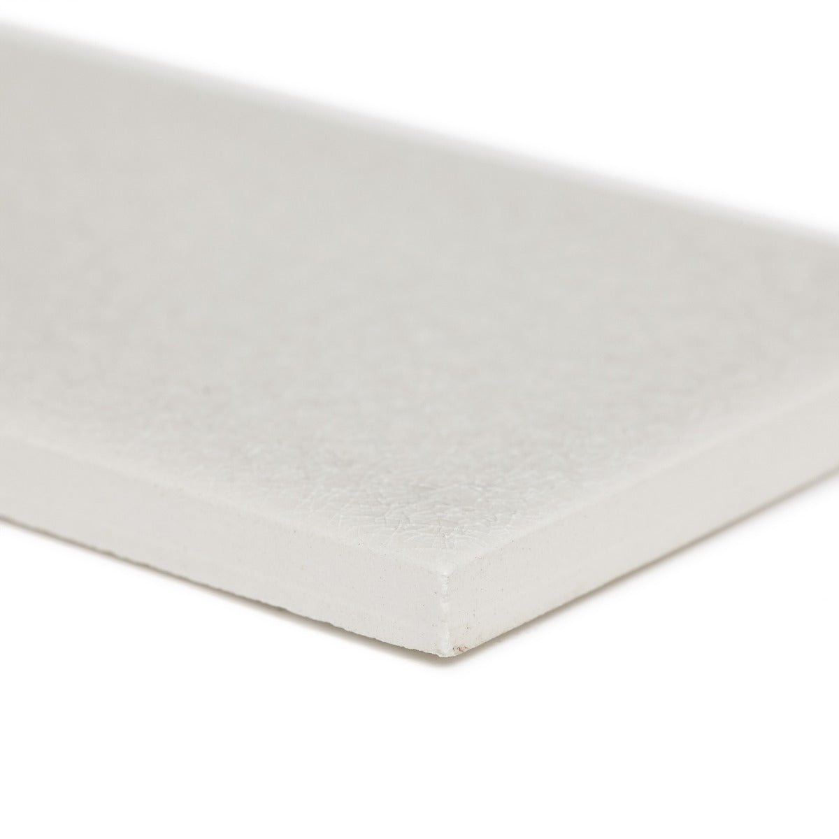 Alhambra grey 7.5 x 15 rectangular glazed tile with a white textured rectangular canvas panel surface