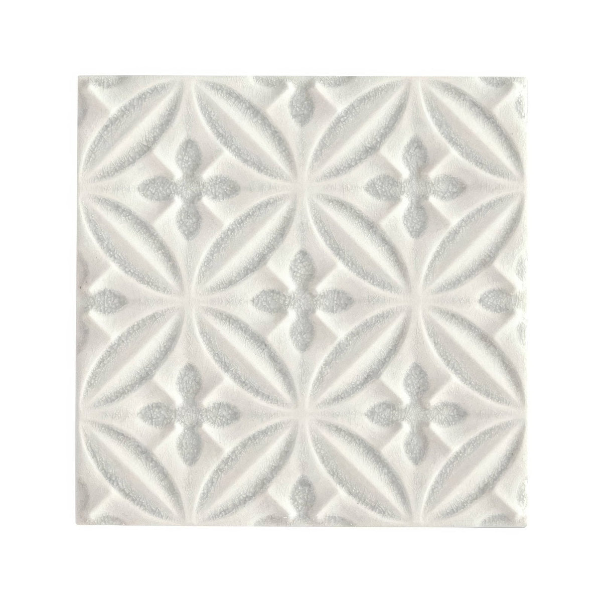
White textured alhambra grey decor glazed tile with repeating geometric interlocking leaf and cross motifs
