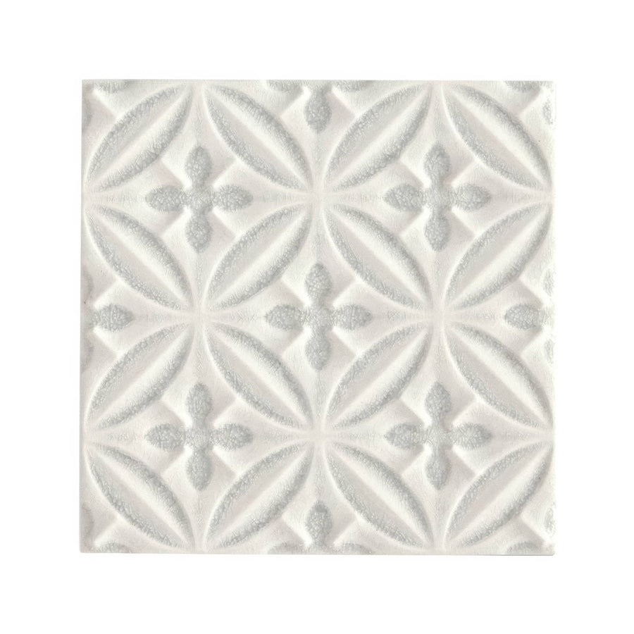 White textured alhambra grey decor glazed tile with repeating geometric interlocking leaf and cross motifs