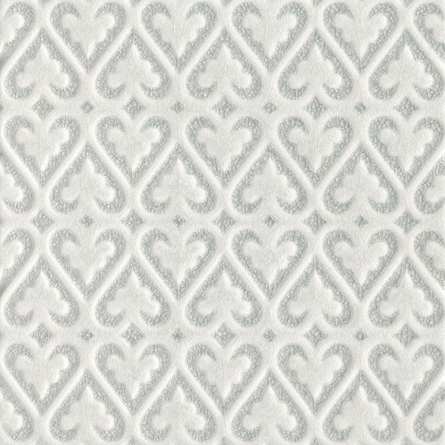 White textured wallpaper with embossed gray diamond motifs featured in alhambra grey decor 2 glazed tile design